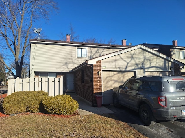 view of side of property with a garage