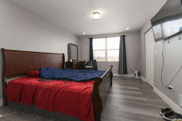 bedroom with hardwood / wood-style flooring