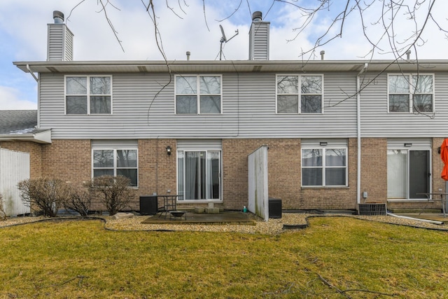 back of property featuring a patio, a yard, and central AC unit