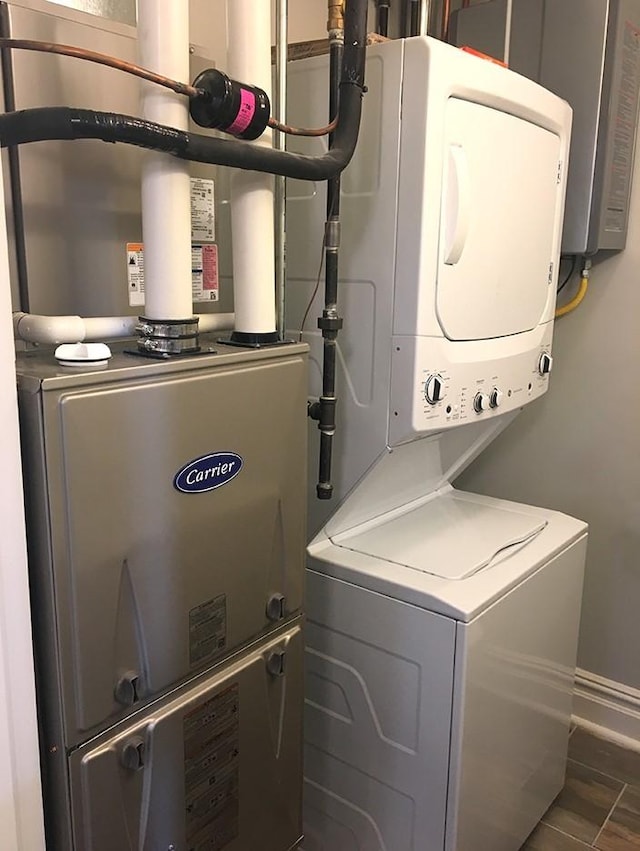 washroom with stacked washer and clothes dryer