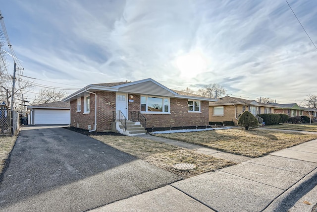 single story home with an outbuilding and a garage