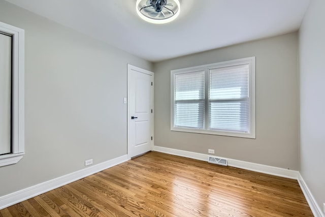 empty room with light hardwood / wood-style floors