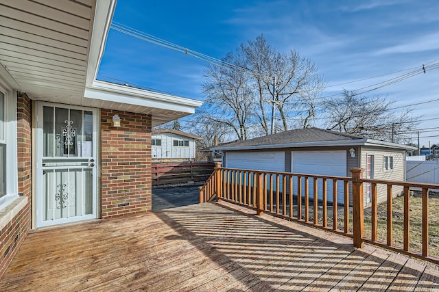 deck featuring a garage and an outdoor structure