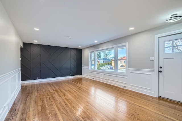 foyer entrance with plenty of natural light and light hardwood / wood-style floors