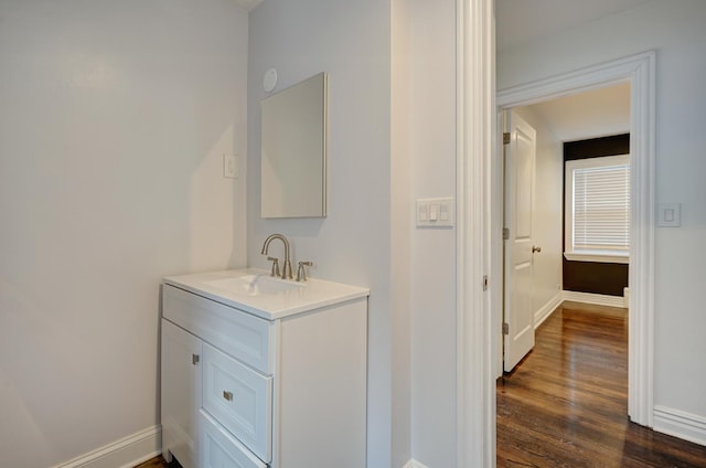 bathroom with vanity and hardwood / wood-style floors