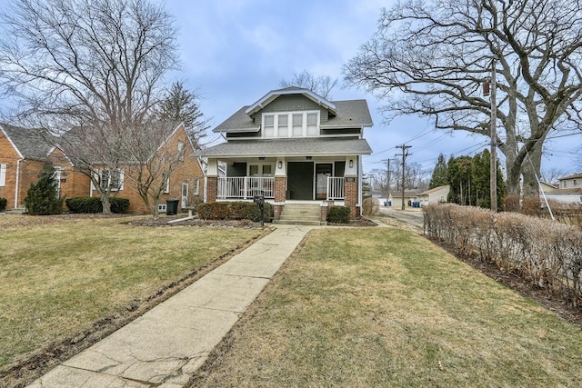 bungalow-style home featuring a porch and a front lawn