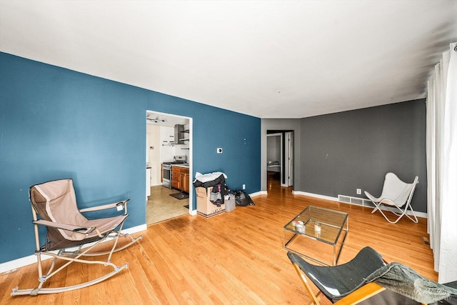 sitting room with light hardwood / wood-style floors