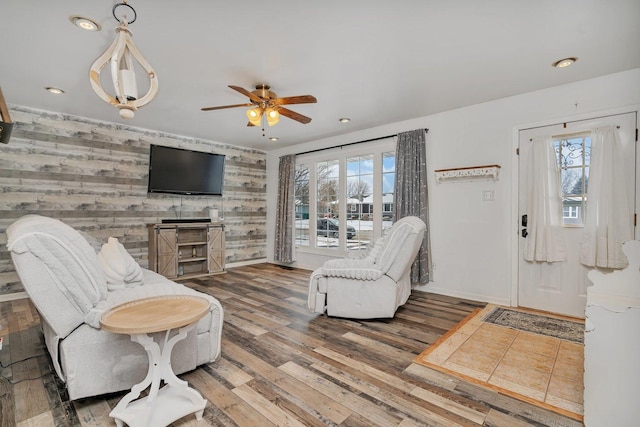 living room featuring hardwood / wood-style flooring and ceiling fan