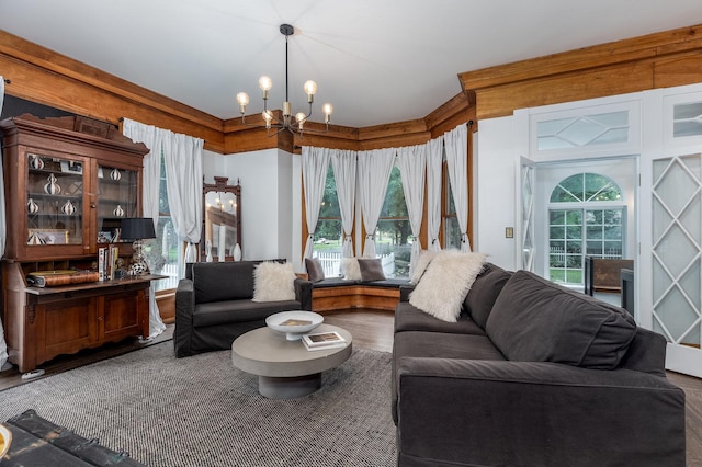 living room with a notable chandelier and hardwood / wood-style floors