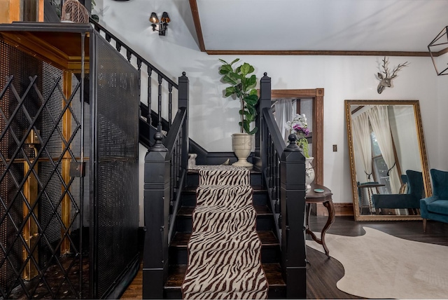 interior space featuring crown molding and hardwood / wood-style floors