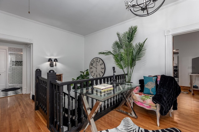 interior space with hardwood / wood-style flooring and crown molding