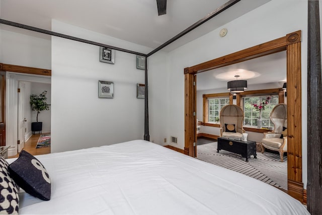 bedroom with hardwood / wood-style flooring and ceiling fan