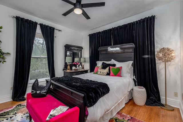 bedroom featuring hardwood / wood-style flooring and ceiling fan