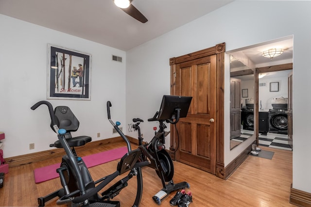 workout area with light hardwood / wood-style floors and ceiling fan