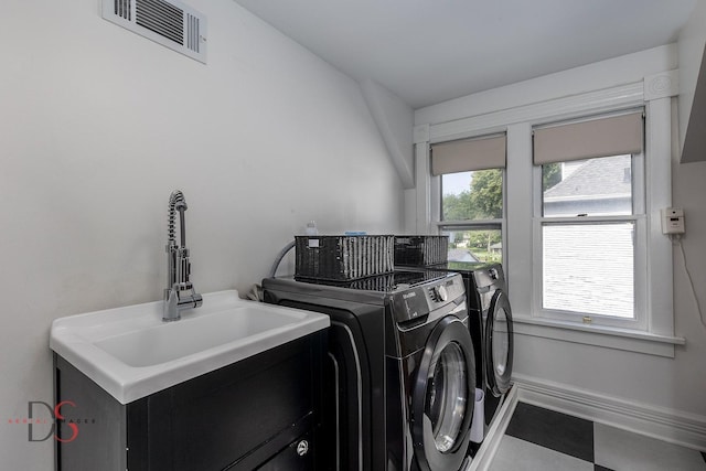 laundry room with sink and washer and dryer