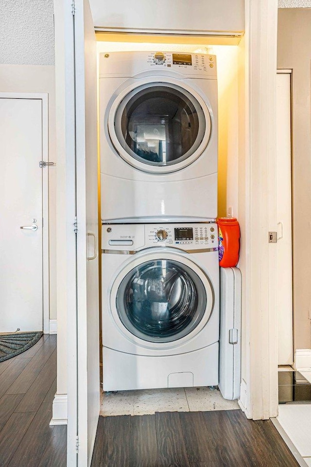 545 N Dearborn St Unit 2709, Chicago, IL 60654 - clothes washing area with stacked washer / drying machine, laundry area, and wood finished floors