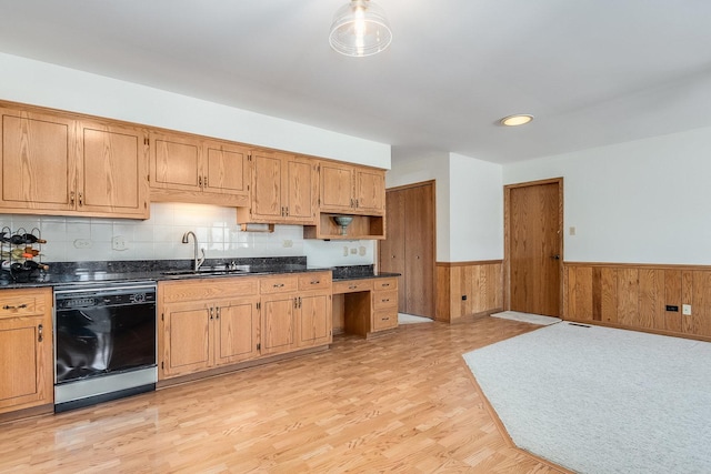 kitchen featuring a wainscoted wall, light wood finished floors, open shelves, a sink, and dishwasher