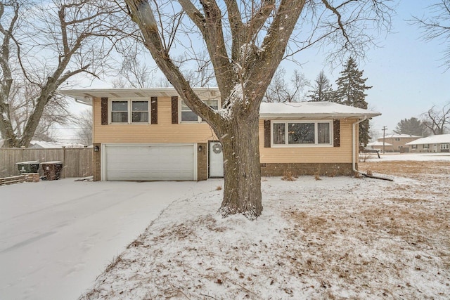 split level home featuring a garage