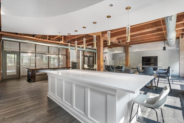 kitchen featuring hanging light fixtures and dark hardwood / wood-style flooring