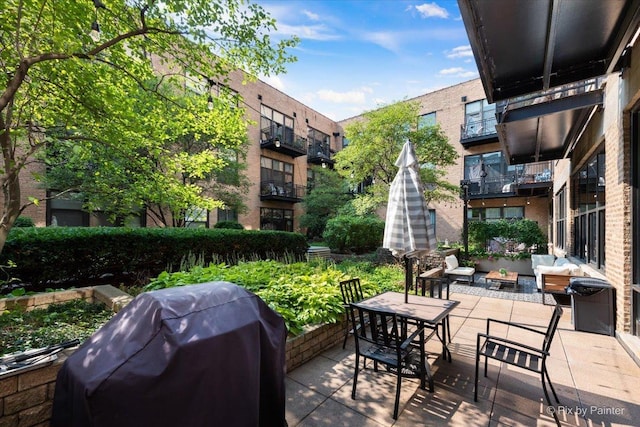 view of patio featuring area for grilling and a fire pit