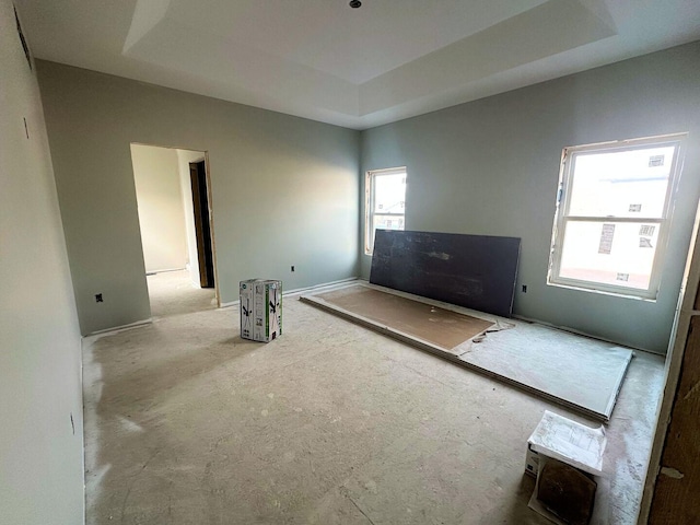 363 Mill Ridge Dr, Byron, IL 61010 - unfurnished living room featuring a raised ceiling and baseboards