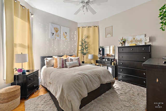 bedroom featuring ceiling fan and light hardwood / wood-style floors