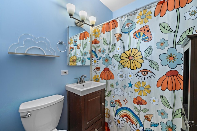 bathroom with vanity, toilet, and a shower with shower curtain