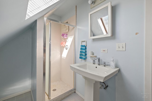 bathroom featuring sink and an enclosed shower