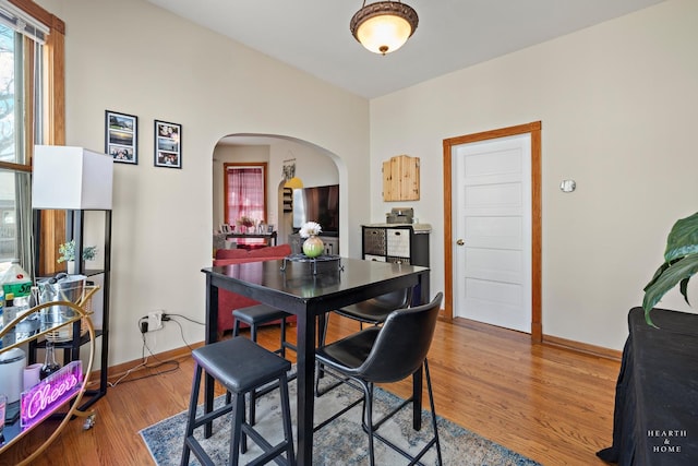 dining area with hardwood / wood-style flooring