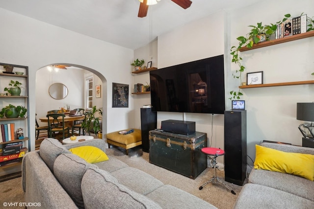 carpeted living room featuring ceiling fan