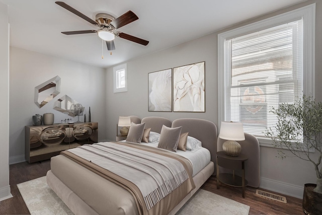 bedroom featuring ceiling fan and dark hardwood / wood-style flooring