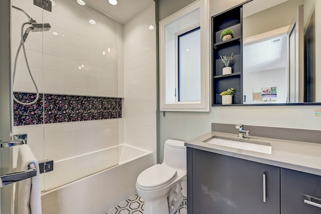 bathroom featuring vanity, toilet, and shower / bathtub combination