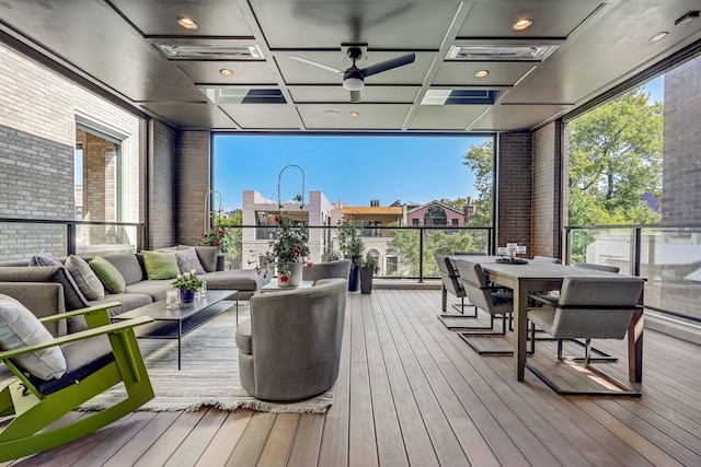 deck featuring ceiling fan, visible vents, an outdoor living space, and outdoor dining space