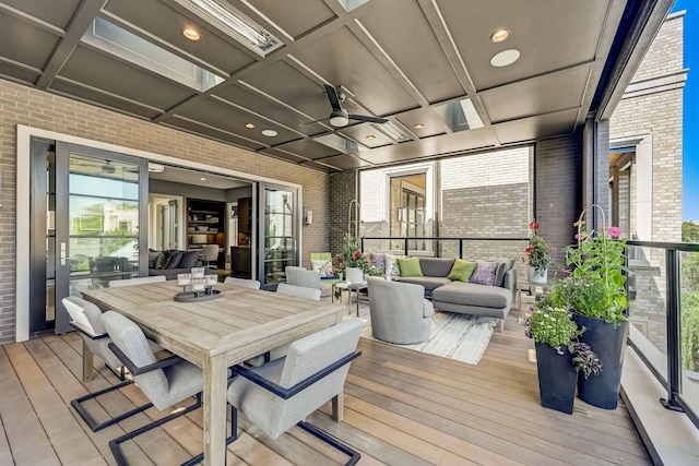 deck featuring ceiling fan, outdoor lounge area, and outdoor dining space