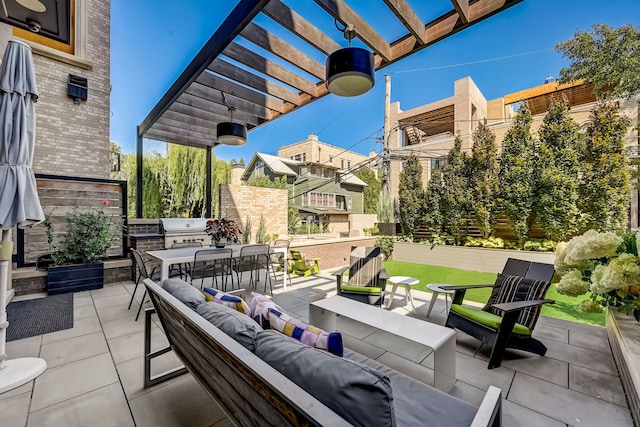 view of patio / terrace with outdoor dining area, an outdoor kitchen, area for grilling, an outdoor living space, and a pergola