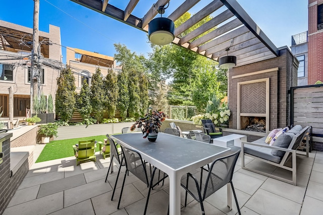 view of patio / terrace with outdoor dining area, an outdoor living space with a fireplace, and a pergola