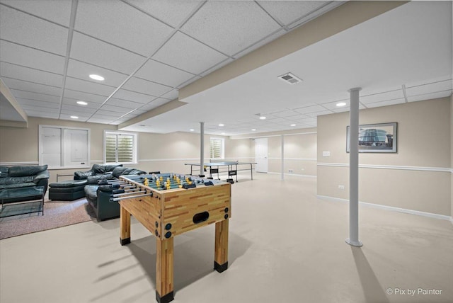 recreation room featuring recessed lighting, visible vents, a drop ceiling, and baseboards