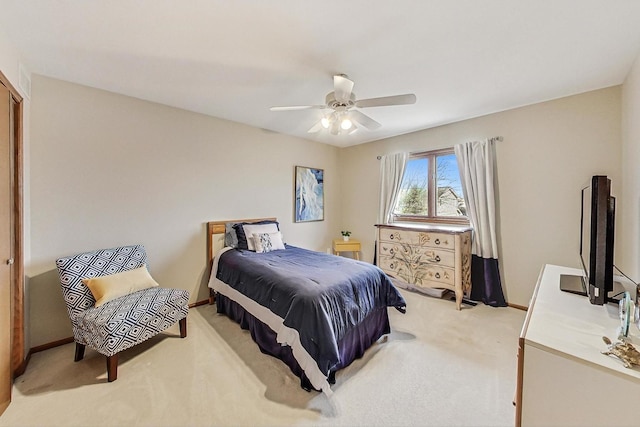 bedroom with light colored carpet and ceiling fan