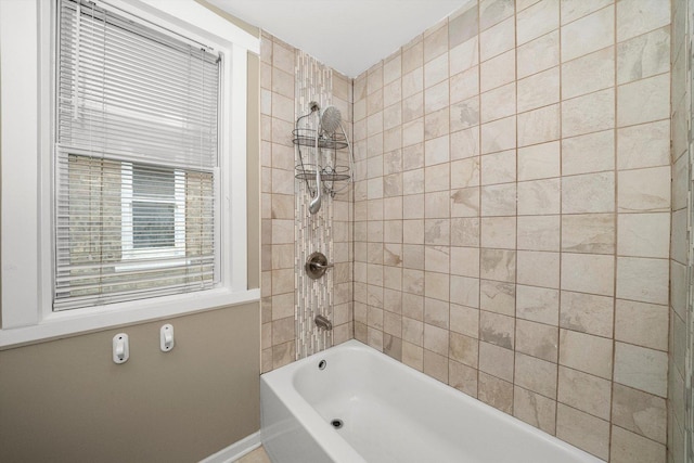 full bath featuring  shower combination and baseboards