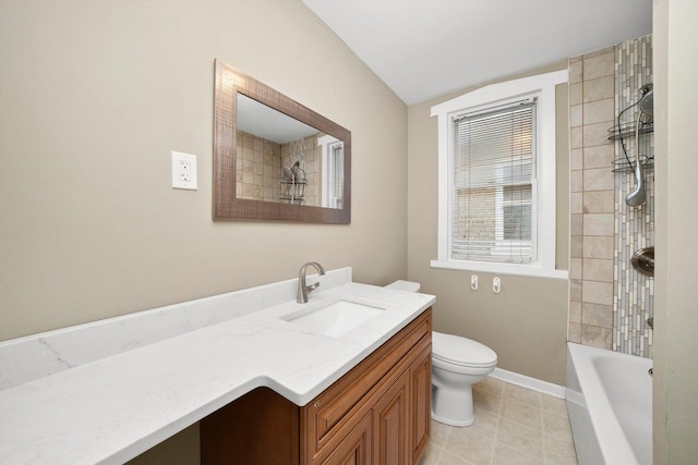 full bath with bathtub / shower combination, toilet, vanity, baseboards, and tile patterned floors