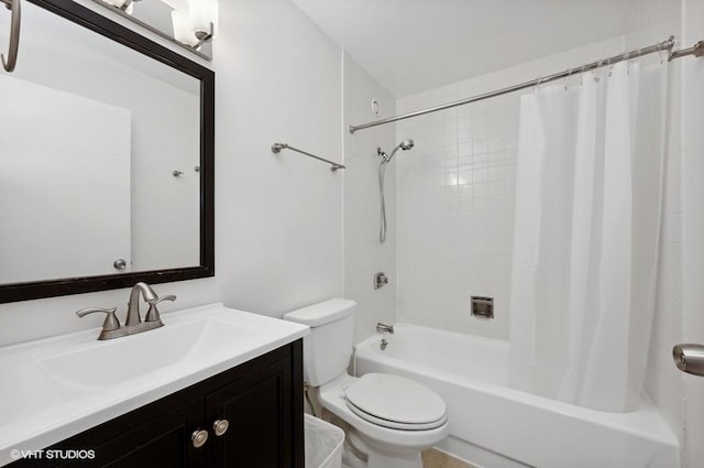 full bathroom with shower / tub combo with curtain, vanity, and toilet