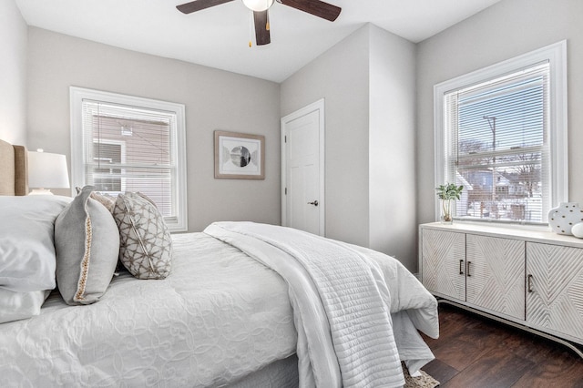 bedroom featuring ceiling fan and dark hardwood / wood-style flooring