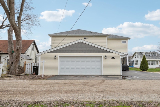 view of property exterior featuring a garage