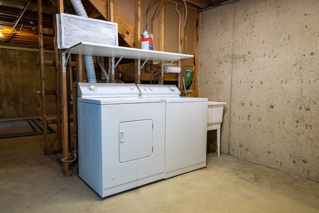 clothes washing area featuring separate washer and dryer