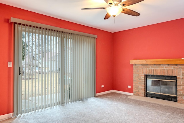 unfurnished living room featuring ceiling fan, carpet flooring, and a fireplace