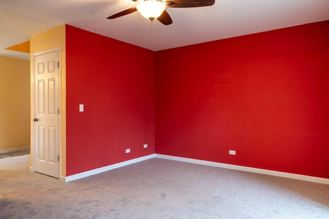 unfurnished room featuring carpet floors and ceiling fan