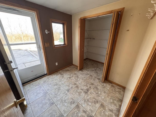 entryway featuring light tile patterned flooring