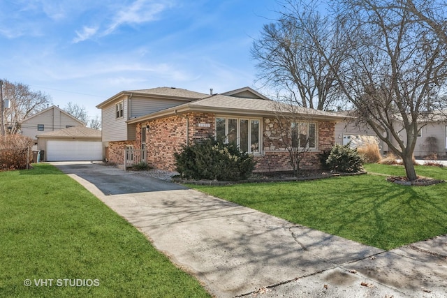 view of front of home featuring brick siding, an outdoor structure, a detached garage, and a front lawn