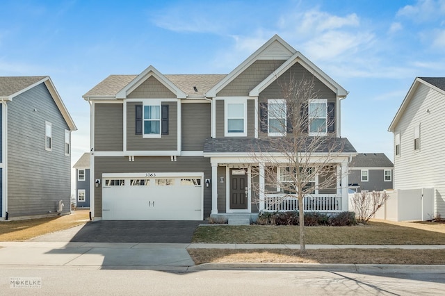 view of front of home with a garage and covered porch