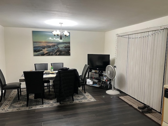 dining space with a chandelier and hardwood / wood-style floors